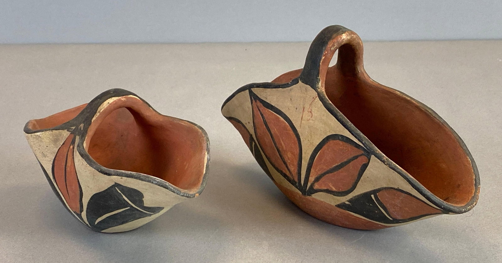 Group of 2 Santo Domingo Pueblo Native American Polychrome Pottery: Largest measures 5 x 8 x 3 inches