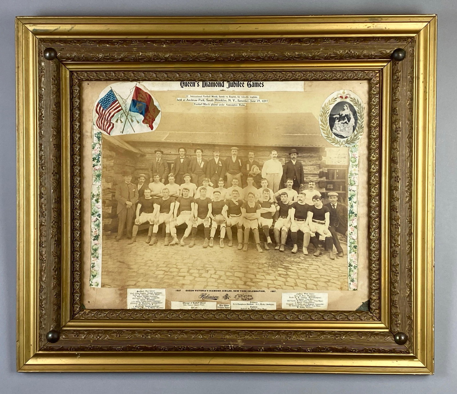 1897 International Football Match Team Queens Diamond Jubilee Photograph: Includes newspaper clippings depicting a Brooklyn football game to celebrate the Queens Diamond Jubilee Games, Photo features players for Scotland vs England, Frame measures 24 x 28 inches.