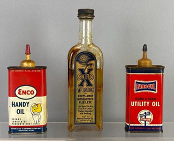 Group of Vintage Advertising Oil Cans and Glass Lotion Bottle