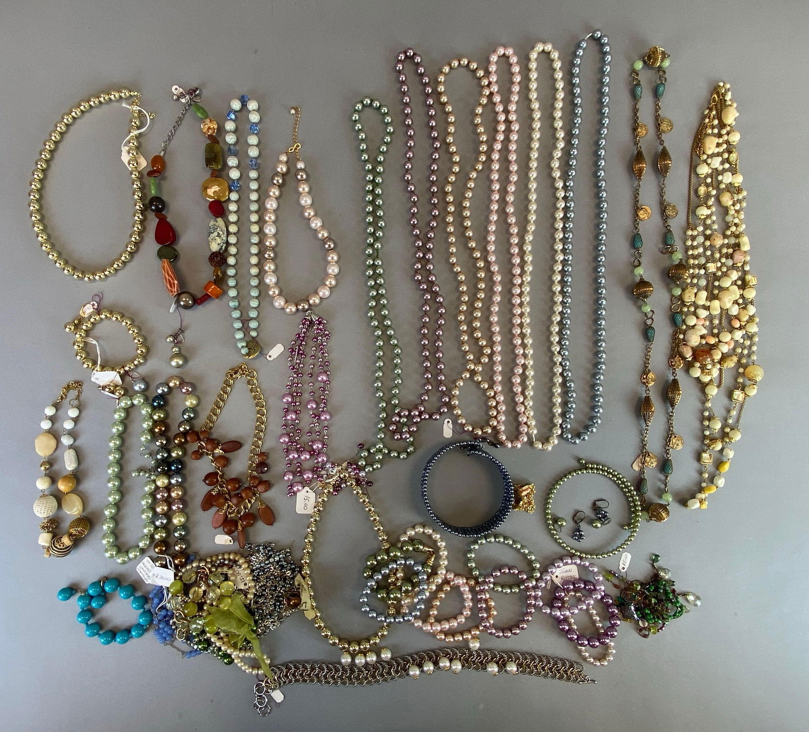 Group of Faux Pearl Costume Jewelry: Includes bracelets, earrings and necklaces, longest measures 40 inches in length