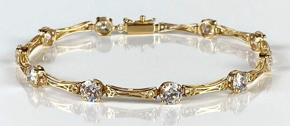 14K Gold CZ Tennis Bracelet: Total weight 5.6g, Measures 7 inches long.