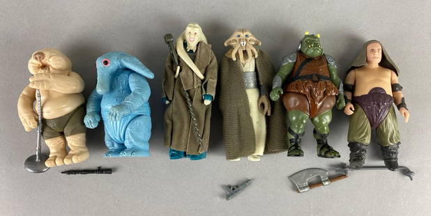 Group of 6 Vintage Kenner Star Wars Action Figures: Includes years 1983 and 1984. Featuring Droopy McCool, Squid Head, Gamorrean Guard and more. Max Reno, Bob Fortuna and Gomorrean Guard are sticky. Largest measures 4 x 2 3/4 x 2 inches.