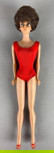 Vintage 1962 Mattel Bubble Cut Barbie Fashion Doll: Brunette hair. Some discoloration. Measures 12 1/4 inches tall.