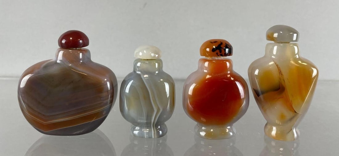 Group of Chinese Carved Stone Snuff Bottles: Largest measures 2 1/4 x 2 x 1 inches
