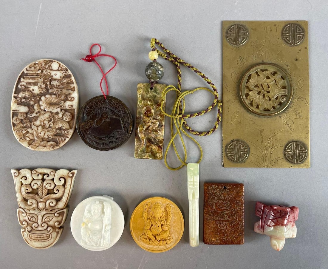 Group of Chinese Carved Stone Items: Includes pendants, pipe, largest measures 6 x 3 1/2 inches