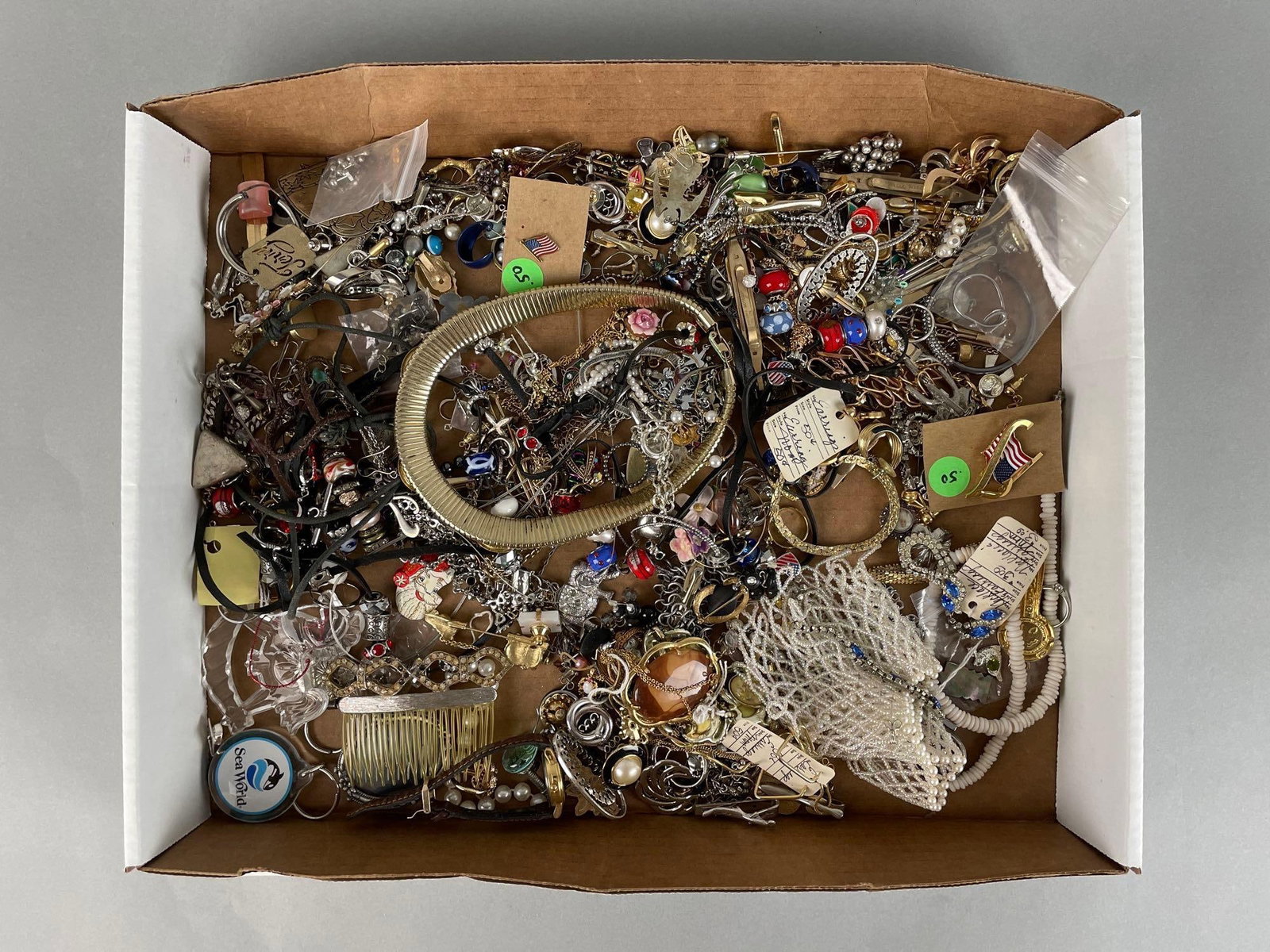 Group of Costume Jewelry: Includes faux gold and silver necklaces, earrings, bracelets. Some tangled. Longest measures 21 inches