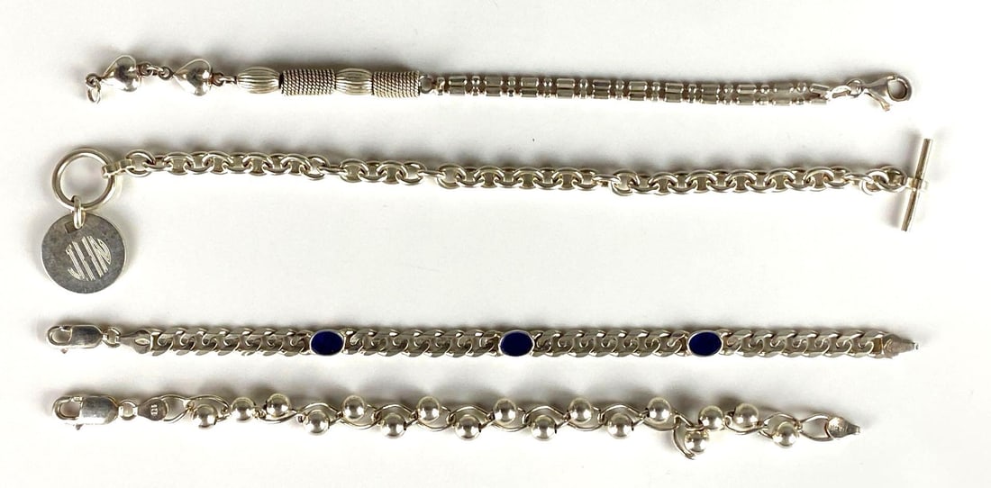 Group of 4 Sterling Silver Link Bracelets: One engraved Jan on end tag, Longest measures 7 3/4 inches long.
