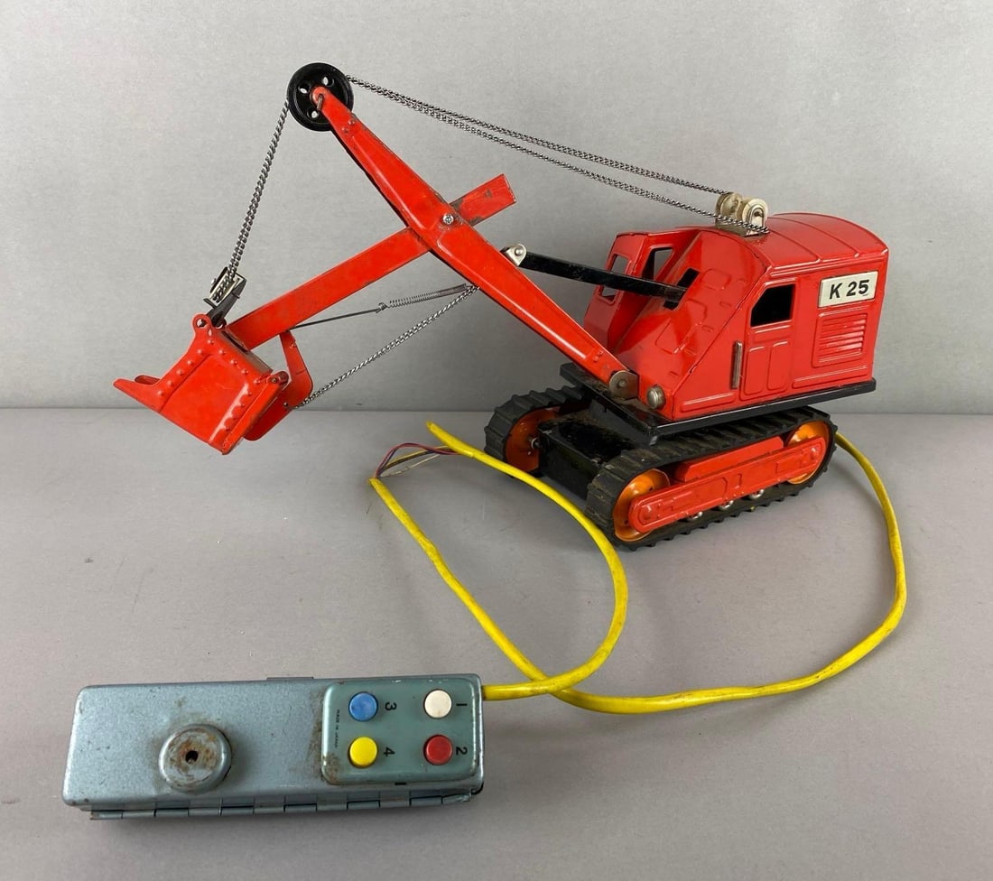 Pressed Steel Tracked Power Shovel Crane: Wire is exposed in a few places. Unknown working condition. Measures 10 x 4 1/2 x 15 1/2 inches.