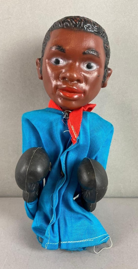 SMC Sugar Ray Leonard Punching Hand Puppet: In working condition. Made in Hong Kong. Robe does have some tears. Measures 9 1/4 x 4 1/2 x 3 1/2 inches.