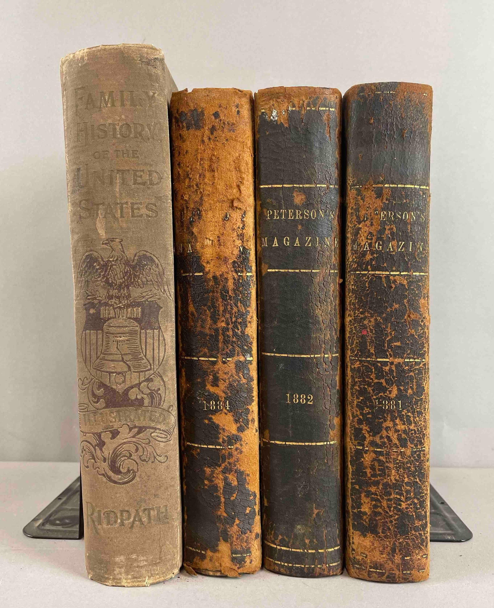Group of 1880s Petersons Magazine Books and More: Includes 1897 family hostory of the united states, 1881, 82, 84 editions of petersons. largest measures 10 1/2 x 7 1/2 inches