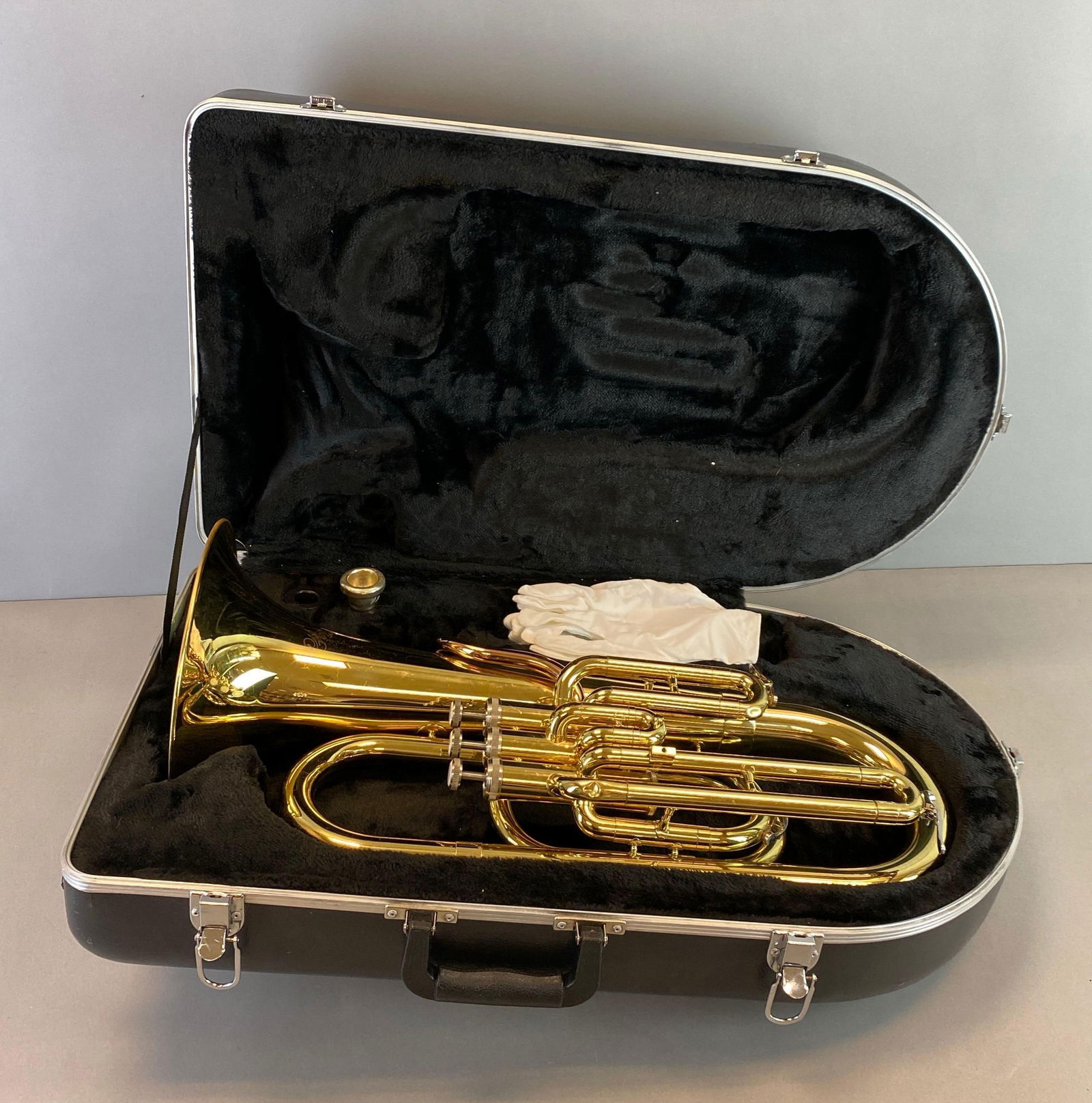 Holton Collegiate B470R Euphonium: Mouthpiece marked 6-1/2 AL, With original case and gloves, scratches and some dents throughout, euphonium measures 23 1/2 x 14 x 10 inches