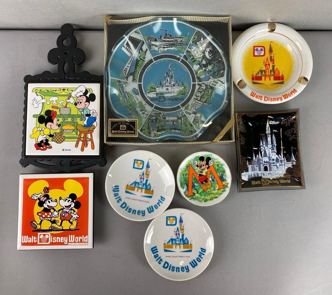 Group of Assorted Disney Plates and more: Includes Walt Disney World ashtray, Mickey and Minnie Hotpad, Walt Disney World hanging plate and more. Largest item measures 7 1/4 x 7 x 2 inches.