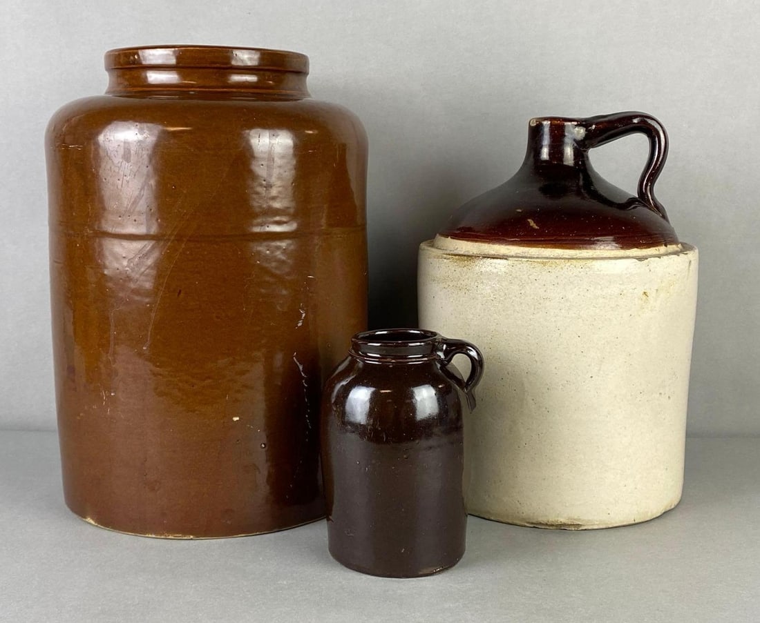 Group of 3 Stoneware Crocks and Jugs: Largest marked Redwing Minnesota Redware Co. on base, Other 2 unmarked, Some chips on rims and handles, Largest measures 15 x 10 1/2 x 10 1/2 inches.