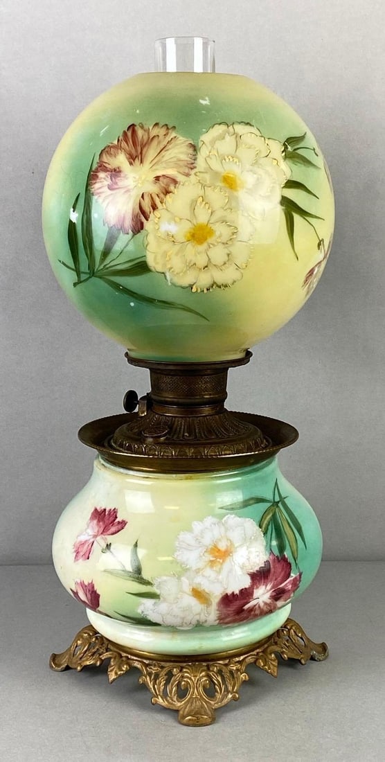 Victorian Hand-Painted Chrysanthemum Gone With the Wind Oil Lamp: Some paint loss on globe, Brass base with glass reservoir and shade, Measures 22 x 9 1/2 x 9 1/2 inches.