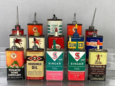Group of Empty Small Advertising Oil Cans