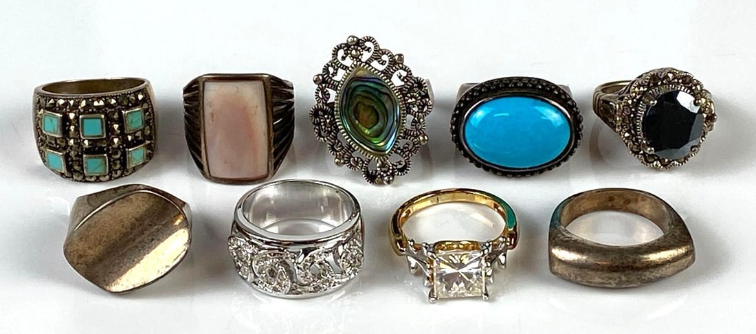 Group of 9 Sterling Silver Rings: Total weight 66.1g, Sizes range from 6 - 8 1/4, Includes turquoise, topaz, CZ, and more.
