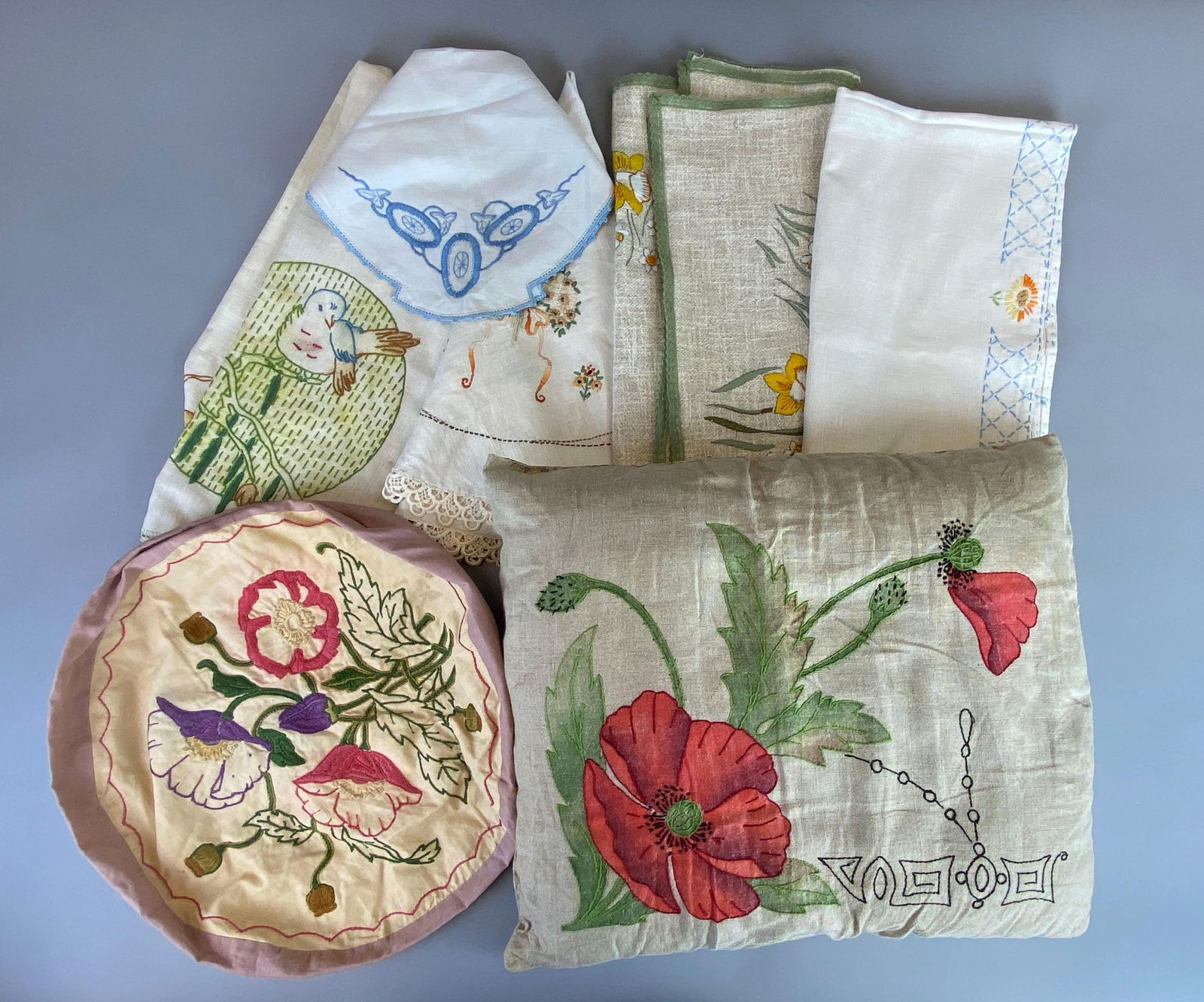 Group of Floral Tablecloths and More: Includes 1 pillow case, 1 pillow and assorted tablecloths, largest pillow measures 18 x 15 inches