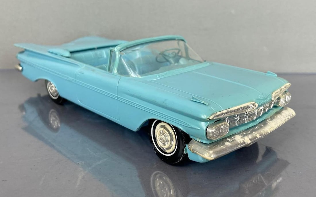 1959 Chevy Impala Convertible Dealership Promo Car: Baby blue, matching interior, some discoloration, wear on chrome, coaster