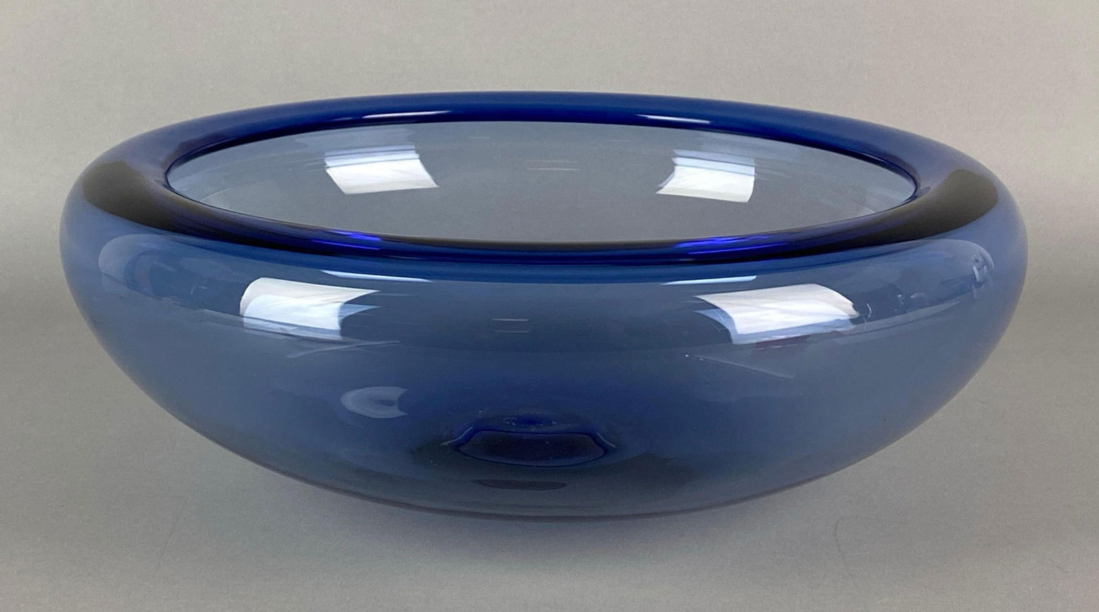 Holmegaard Signed Per Lutken Sapphire Blue Art Glass Bowl: Marked on faceted pontil mark, UV Reactive, measures 4 x 12 1/2 inches