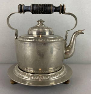 Antique Metal Teapot and Trivet: Is tarnished and needs a good cleaning. Marked 343/3 on bottom of teapot. Measures 7 x 8 1/2 x 7 1/2 inches.