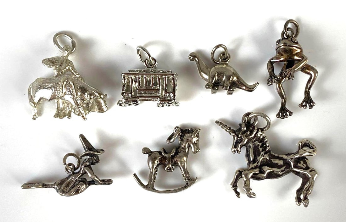 Group of 7 Sterling Silver Charms: Includes unicorn, witch, dancing frog, and more, Largest measures 1 x 1 inch.