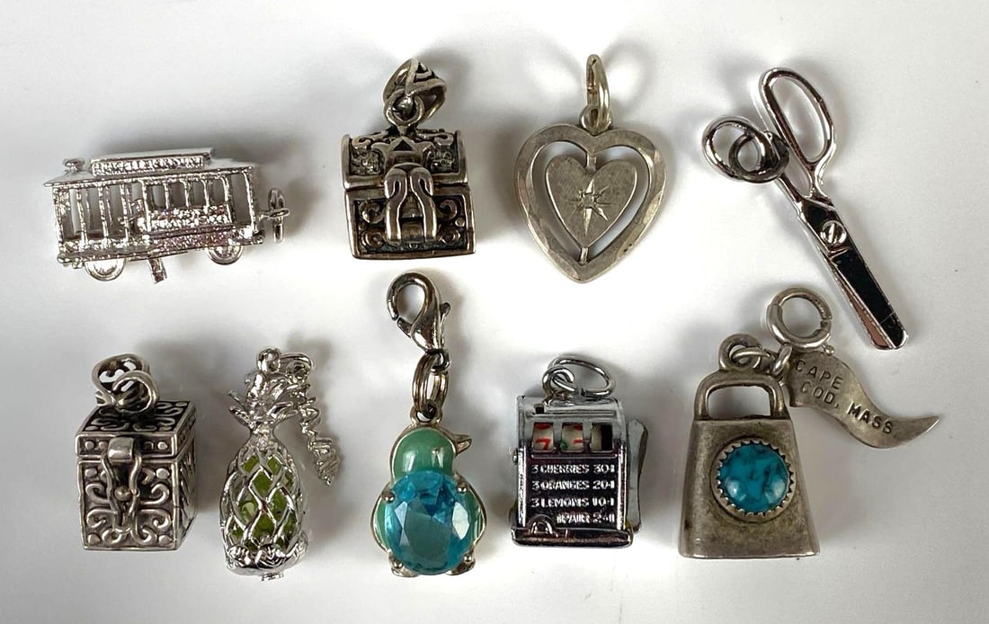 Group of 9 Sterling Silver Charms: Includes slot machine, chest, trolly car, and more, Largest measures 1 x 1/2 inch.