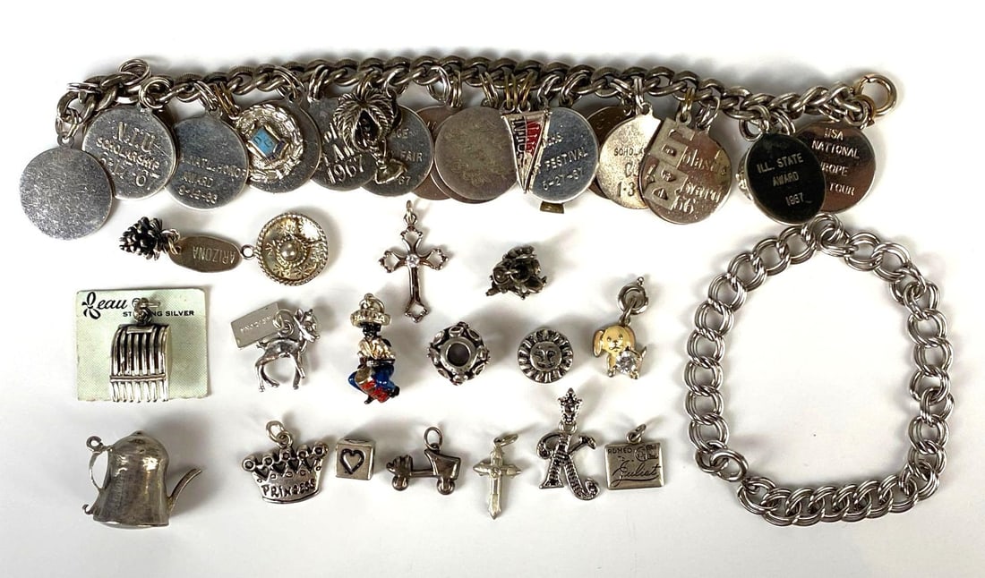 Group of Sterling Silver Charms and Bracelets: Includes some costume jewelry, Includes teapot, states, crosses, and more, Longest bracelet measures 6 1/2 inches long.