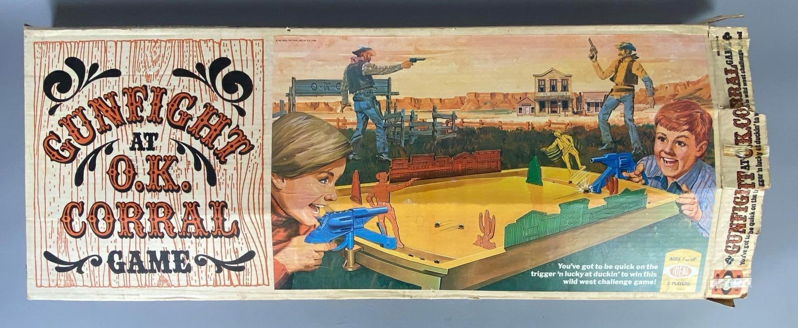 1973 Ideal Gunfight at the O.K. Corral Game: In working condition, Looks complete, Some dents and tears in box, Box measures 14 1/2 x 35 1/4 x 2 1/4 inches.