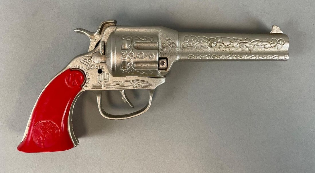 Vintage Kilgore Engraved Cowboy Cap Gun: Lone Ranger style figure on Bakelite grip. Working condition, measures 8 1/4 x 4 x 1 3/4 inches