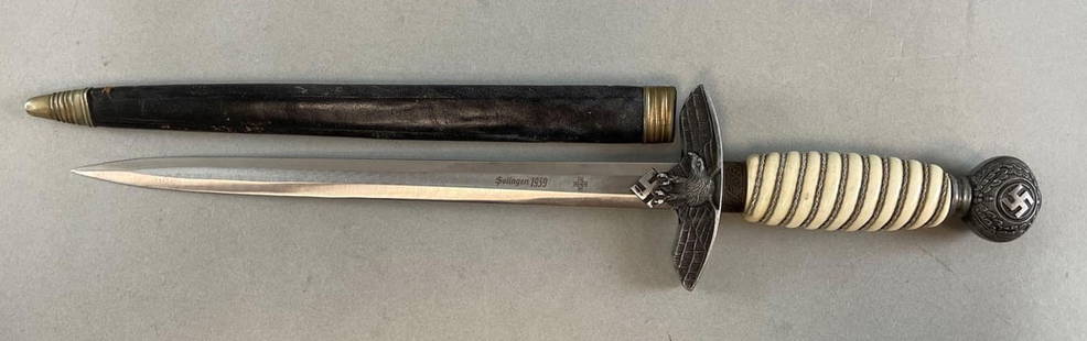 Reproduction WW2 German Officers Dagger with Scabbard: Reproduction, etched Solingen 1939, measures 15 inches, 9 3/4 inch blade
