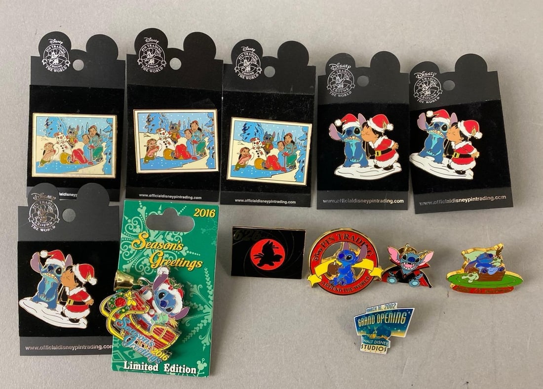 Group of 12 Disney Enamel Pins: Includes Lilo and Stitch Christmas, Lilo kissing Stotch, 2016 Stitch Season Greetings and more. Largest pin measures 1 3/4 x 1 3/4 inches.
