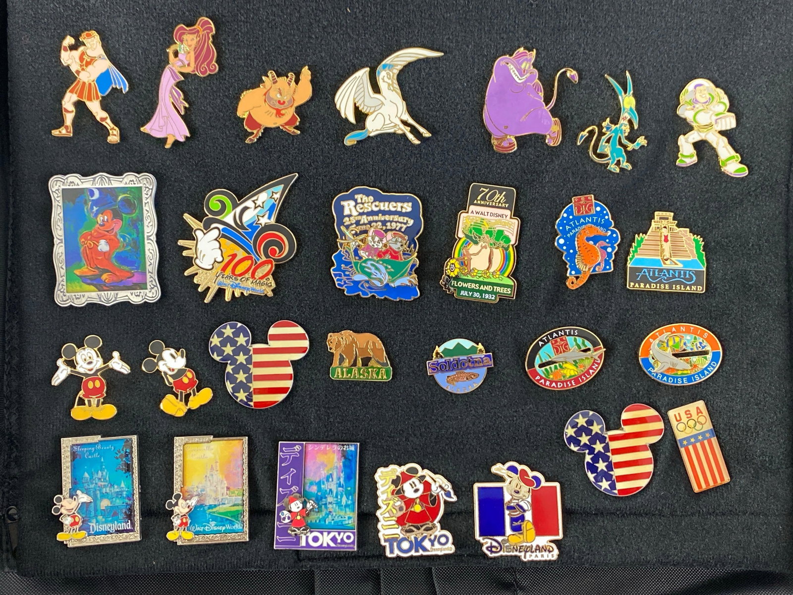 Group of 20+ Disney Enamel Pins: Includes Mickey Mouse, Hercules, Tokyo and more, largest measures 2 x 1 1/2 inches