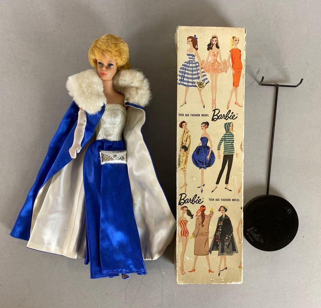 Mattel Blonde Bubble Cut Barbie Doll and More: 1962 includes original box and stand. Box is missing one side. Box measures 12 x 3 x 3 3/4 inches.
