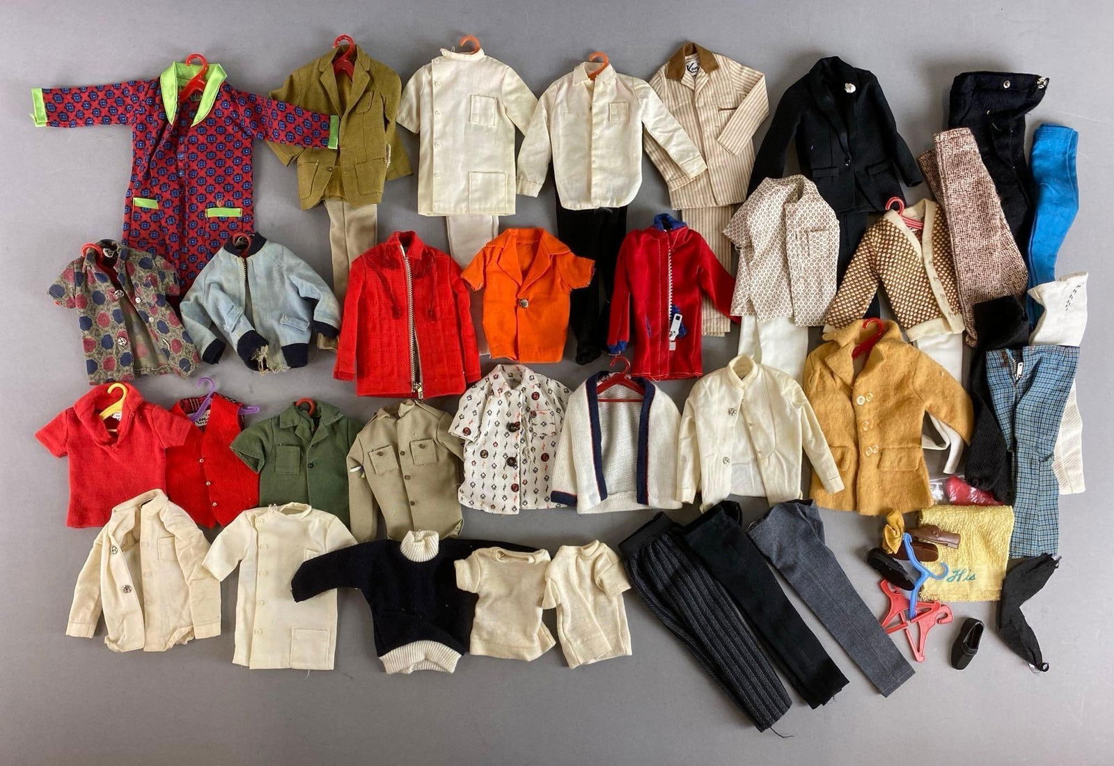 Group of Vintage Mattel Ken Fashion Clothes: Set completions unknown. Includes Ken goes Bowling, Ski Champion Coat and more. Largest item measures 7 3/4 inches.