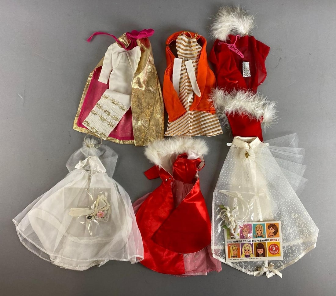 Group of 6 Mattel Barbie Fashion Outfits: Outfits completion unknown. Includes Barbie magnificent, #1849 Wedding wonder and more . Largest item measures 11 1/2 inches.