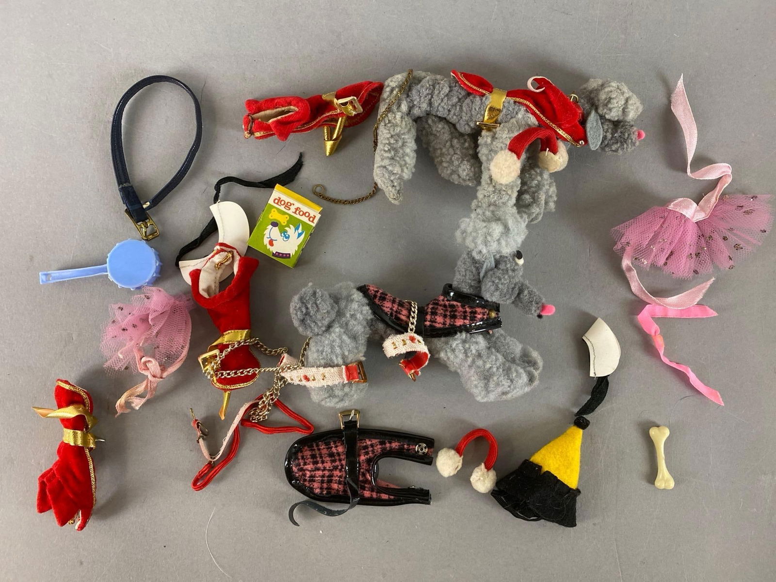 Group of 2 Mattel Barbie Dogs and More: Includes Bone, dog food, leash and more. Largest item measures 3 1/4 x 1 1/4 x 5 inches.