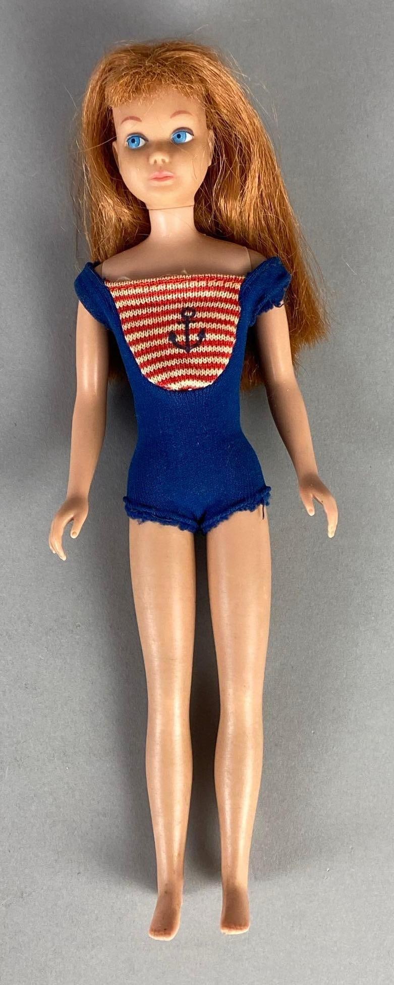 1953 Mattel Barbies Little Sister Skipper Titian Hair Fashion Doll: In original bathing suit, Measures 9 inches tall.