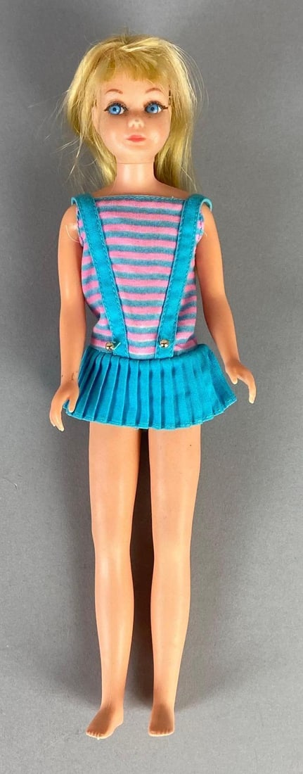 1967 No. 2 Mattel Barbies Little Sister Skipper Blonde Fashion Doll: Pink and blue striped dress, Measures 9 inches tall.