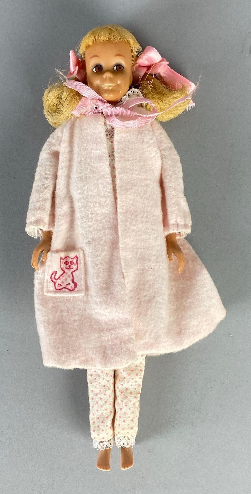 1963 No. 6 Mattel Barbies Little Sister Skipper Blonde Fashion Doll: Pink pajama set and bathrobe with original 1963 tag, Doll measures 9 inches tall.