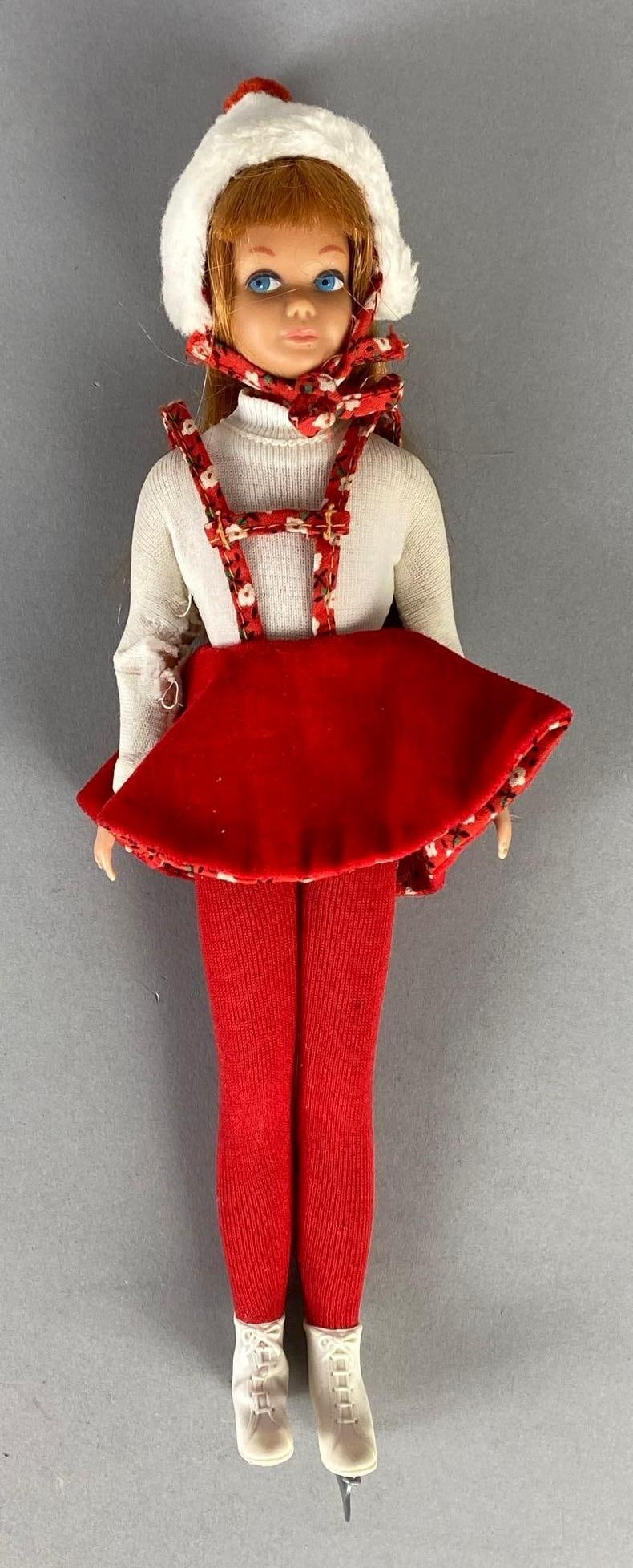 1963 No. 3 Mattel Barbies Little Sister Skipper Titian Hair Fashion Doll: Dressed in No. 1908 Skating Fun fashion outfit, missing one skate blade and muff, Right arm sleeve torn, Measures 9 inches tall.