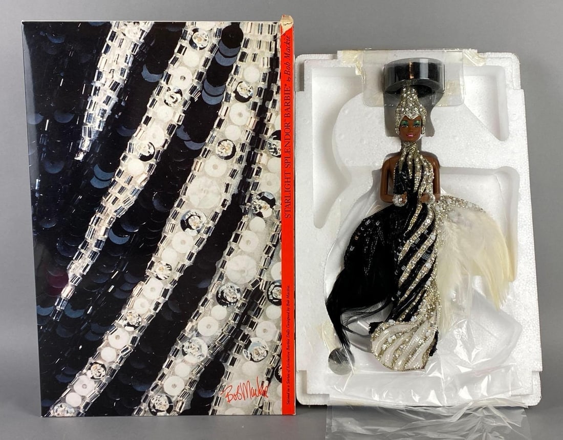 1991 Mattel Bob Mackie Starlight Splendor Barbie Fashion Doll: In original box, 2nd in the Bob Mackie Barbie Collection Series, With reproduction of Bob Mackies original signed illustration, Small tear on top right corner, Box measures 16 x 10 1/2 x 3 1/2 inches.