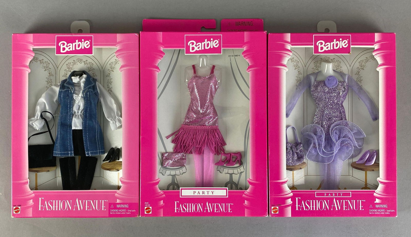 Group of 3 1990s Mattel Barbie Fashion Avenue Fashion Doll Outfits: Like new in packaging, Includes Jean vest set, party pink fringed dress and lavender dress, in original packaging, all fit 11 1/2 inch dolls