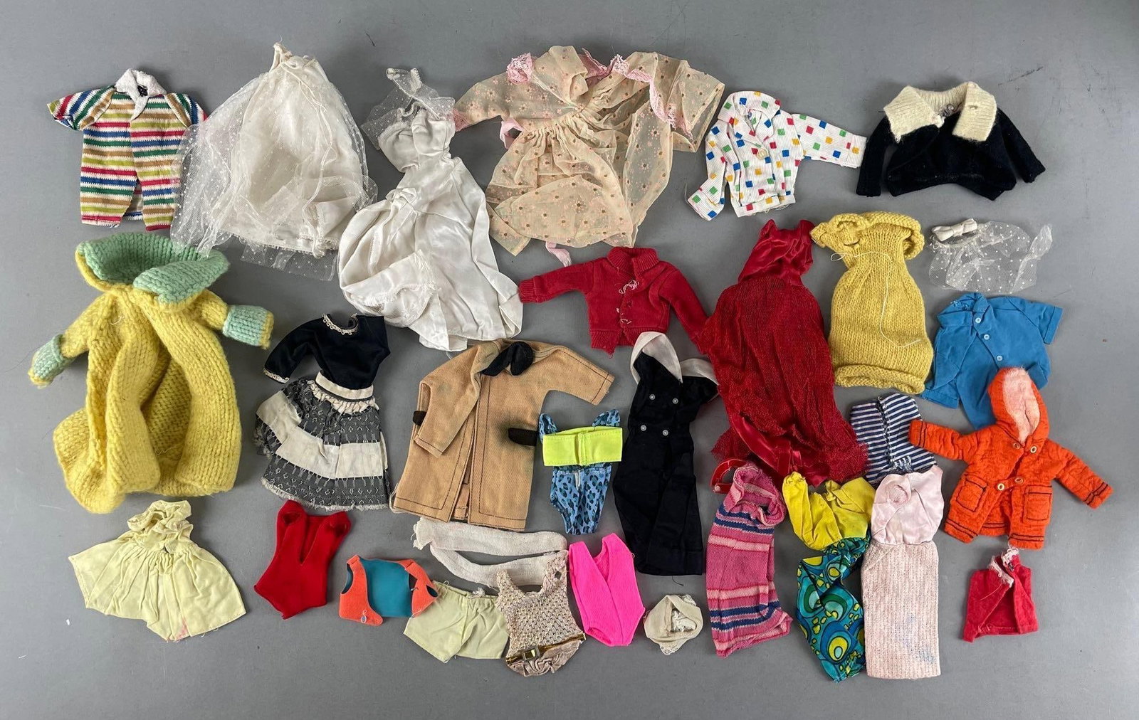 Group of Vintage Barbie and Ken Fashion Doll Clothing: Includes Allen's shirt, wedding dress, swimsuits, and more