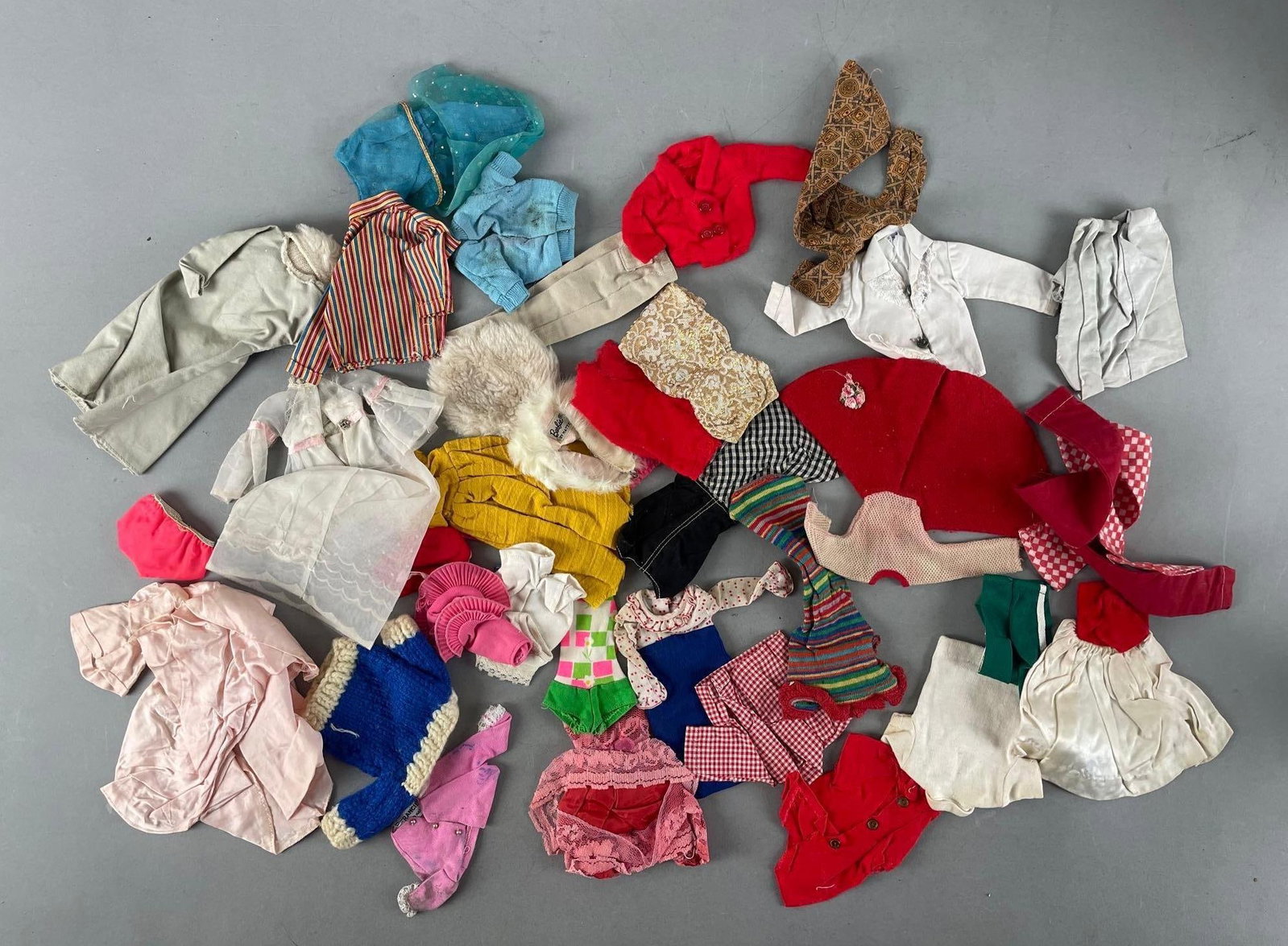 Group of Vintage Barbie and Ken Fashion Doll Clothing: Dresses, shirts, skirts