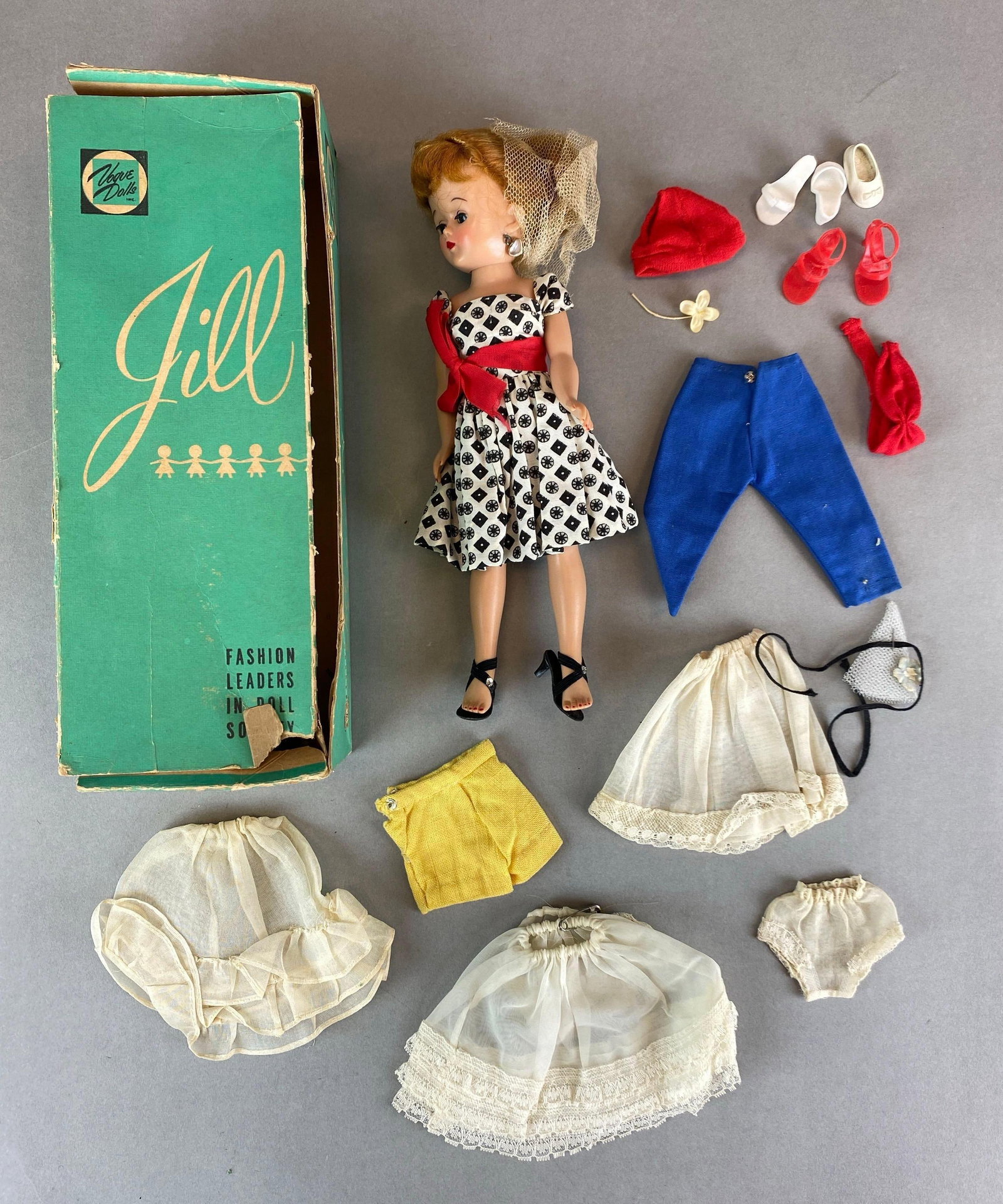 Vintage Vogue Jill Walker Fashion Doll With Accessories: walking mechanism is working condition, includes shoes, skirts, pants and more, some wear to box, doll measures 10 inches tall