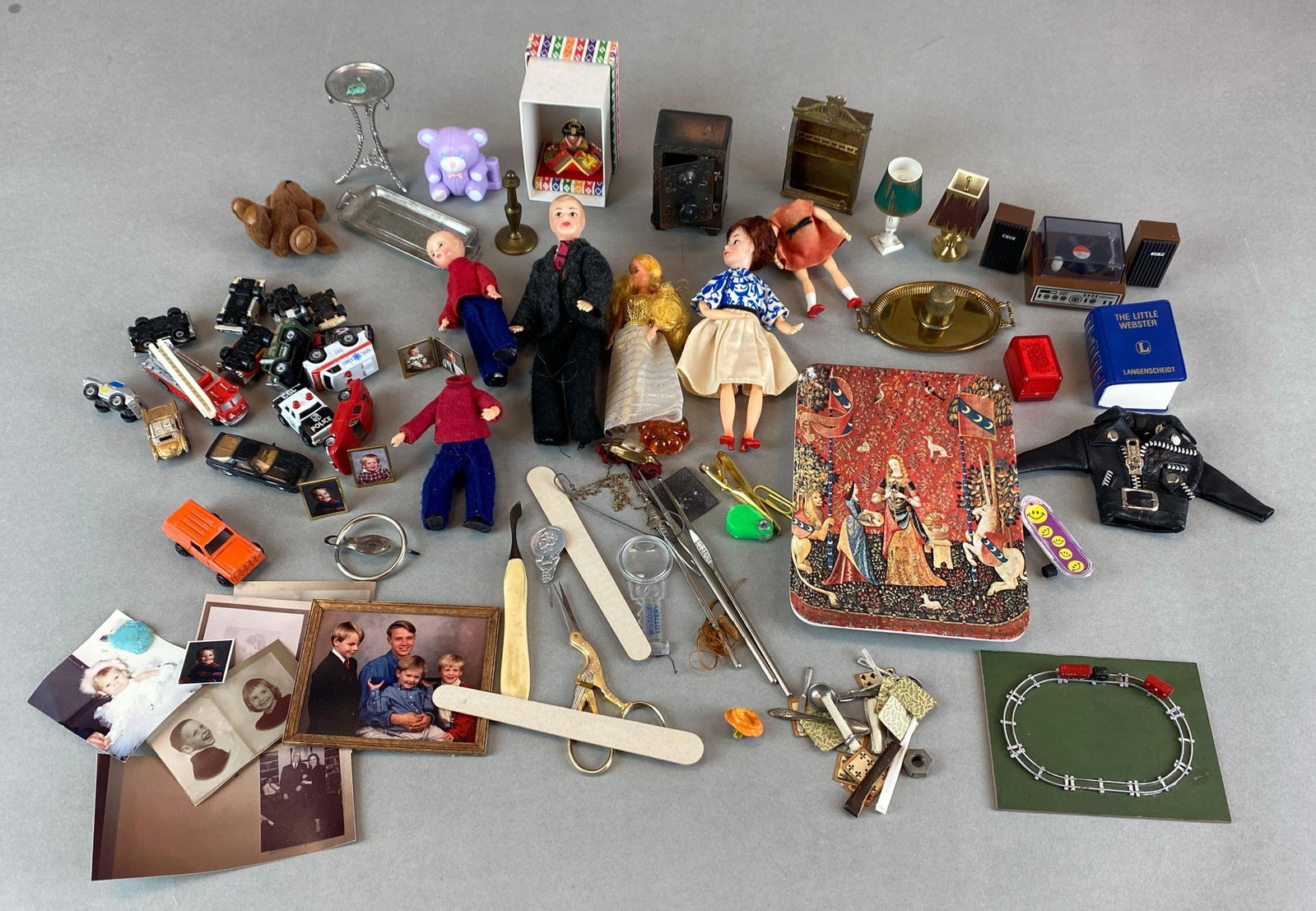 Group of Vintage Miniatures and Doll Accessories: Includes photographs, flatware, dolls, toy cars and more, largest measures 6 x 4 inches