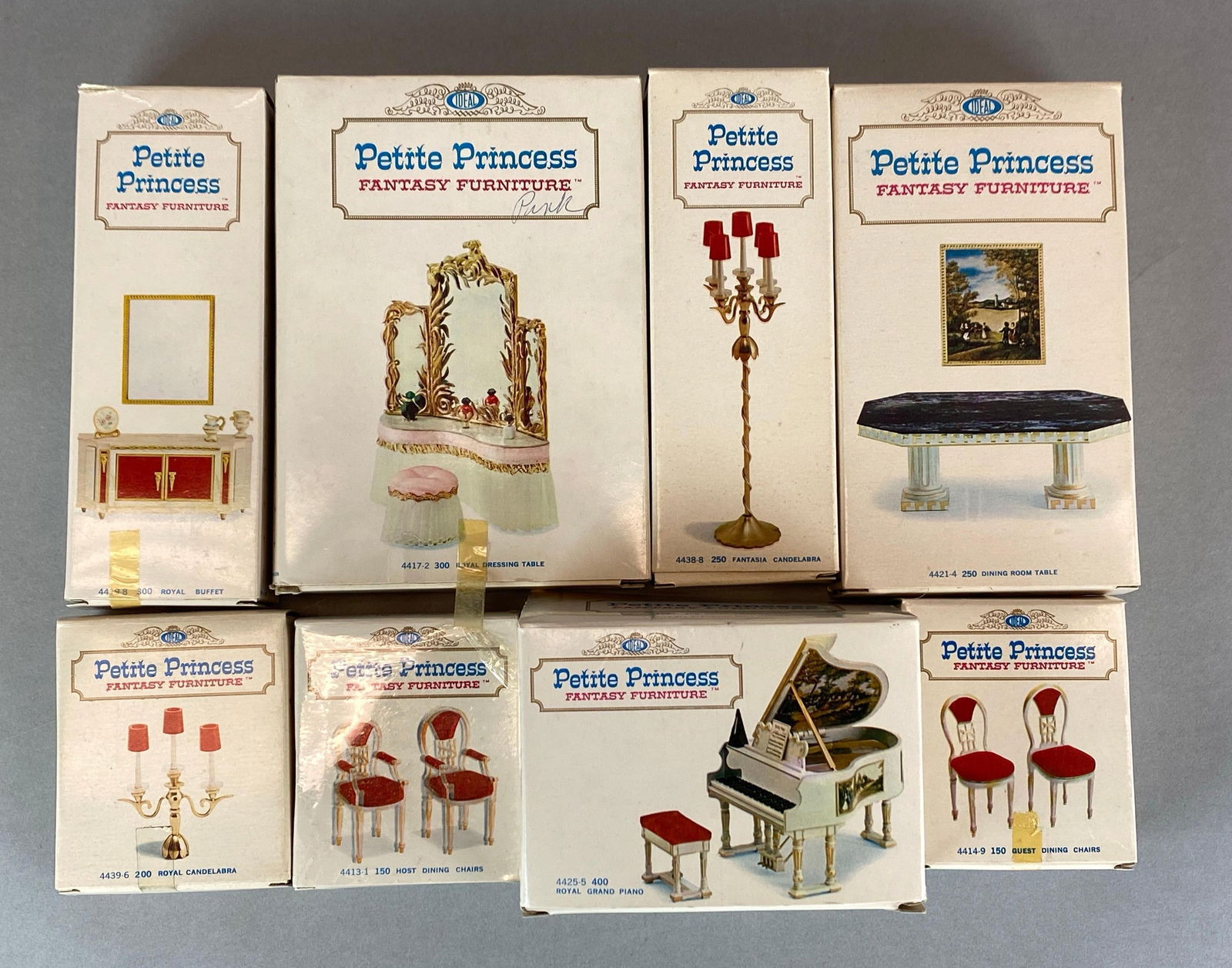 Group of 8 Petite Princess Miniature Doll Fantasy Furniture: all in original boxes, includes Royal Grand Piano, Guest Dining Chairs, Royal Candelabra and more, largest measures 7 x 5 x 1 1/2 inches