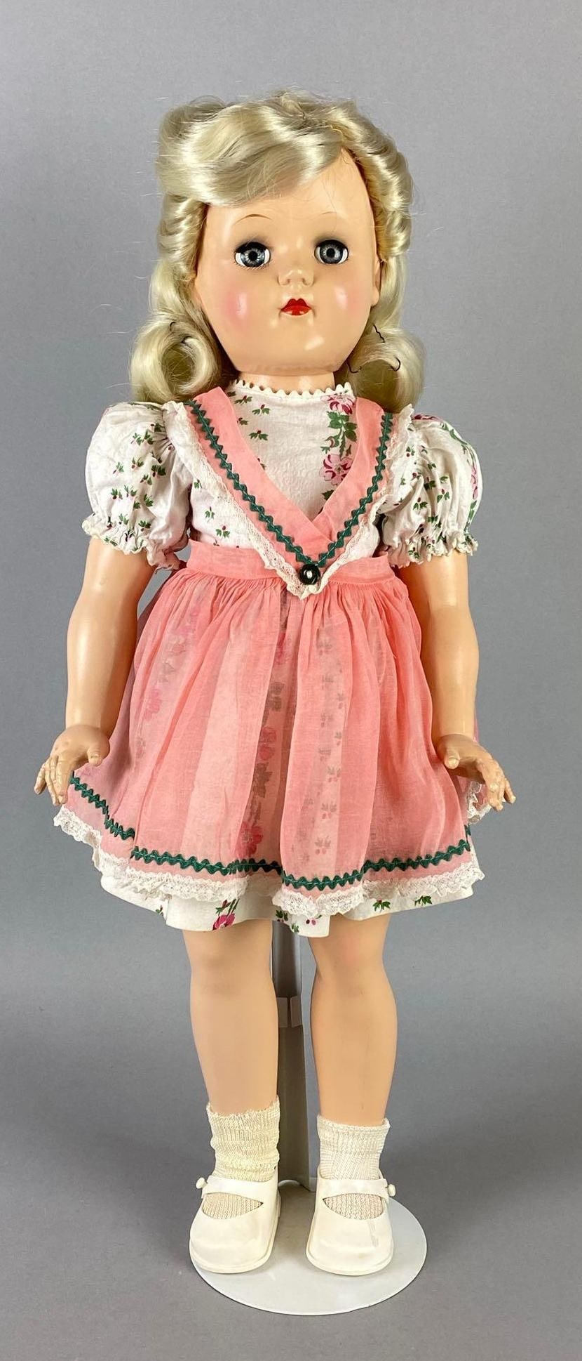 Vintage Ideal Toni P-93 Blonde Doll: Blue Sleepy Eyes, Doll stand included, Doll measures 20 1/2 inches tall.