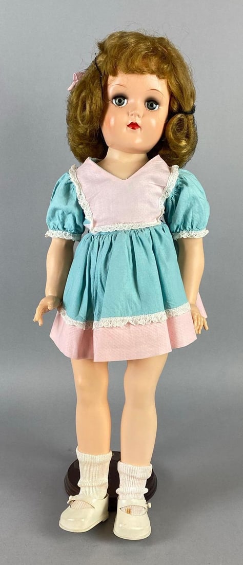 Vintage Ideal Toni P-93 Blonde Doll: Green Sleepy Eyes, Doll Stand included, Doll measures 20 1/2 inches tall.