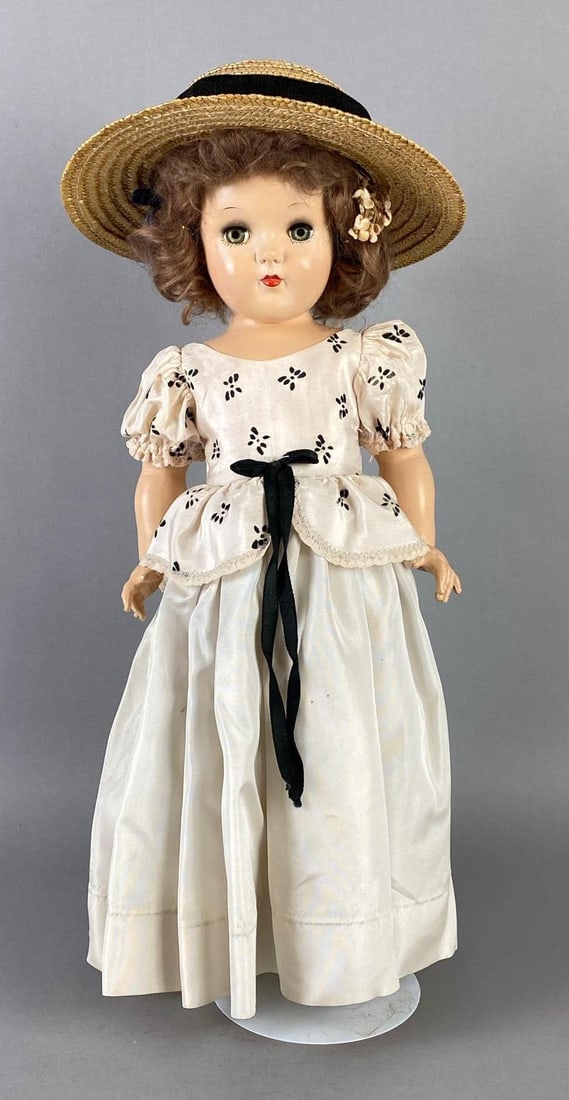 Vintage Ideal Toni P-92 Brunette Doll: Green sleepy eyes, Some marks around eyes, Doll stand includes, Doll measures 19 inches tall.